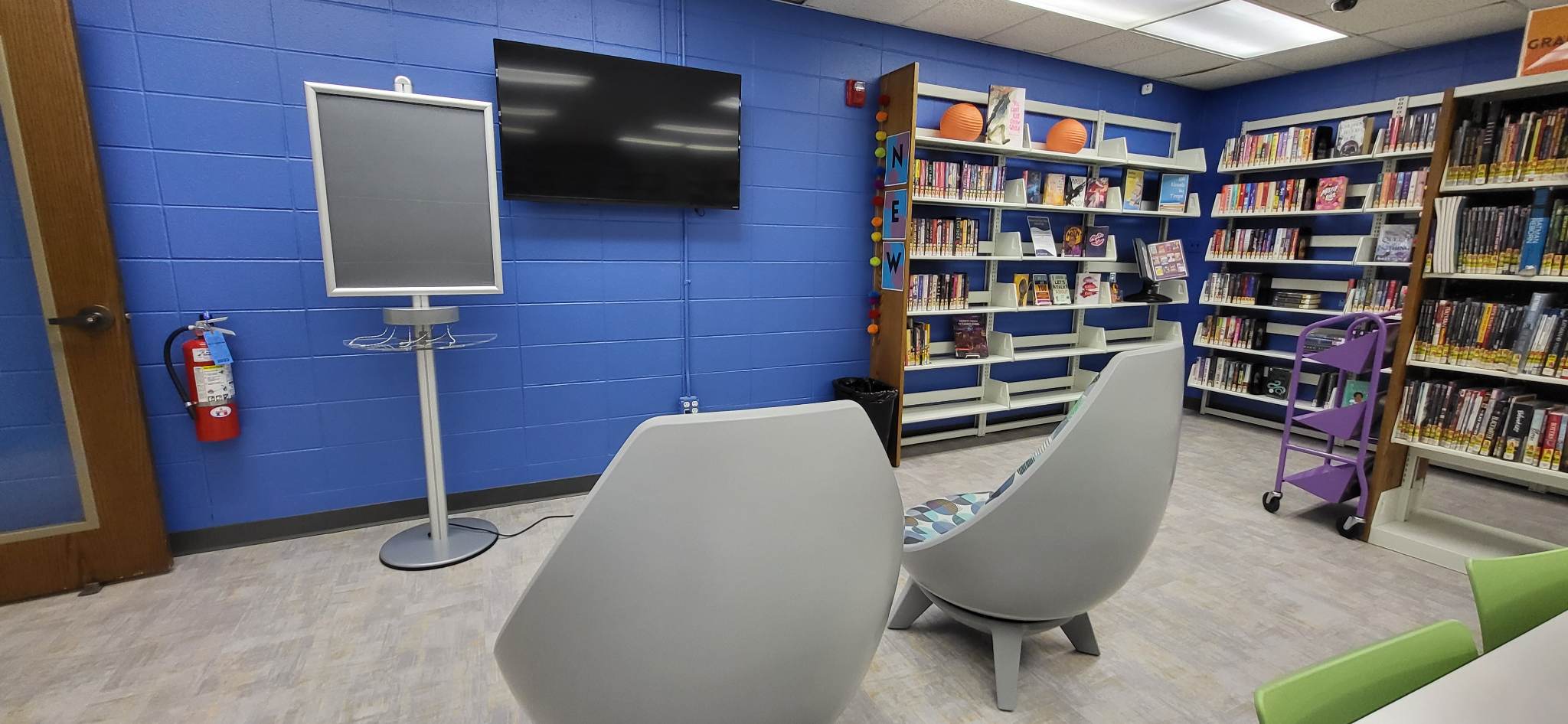 Teen Space showing chairs facing a mounted television