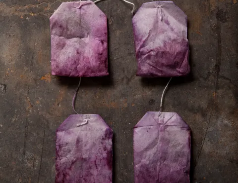 There is a picture showing 4 used teabags that have a purple hue. Similar to Lavender 